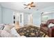 Relaxing bedroom with a leather recliner and access to bathroom at 3782 Pine Cone Ln, Ormond Beach, FL 32174