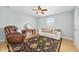 Cozy bedroom with leather recliner and a comfy sofa at 3782 Pine Cone Ln, Ormond Beach, FL 32174