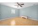 Light and airy bedroom with wood flooring and ceiling fan at 3782 Pine Cone Ln, Ormond Beach, FL 32174