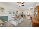 Open dining area with seating for four and access to the back patio at 3782 Pine Cone Ln, Ormond Beach, FL 32174