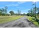 Long driveway leading to a spacious property at 3782 Pine Cone Ln, Ormond Beach, FL 32174