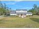 Two-story house with covered porch and large yard at 3782 Pine Cone Ln, Ormond Beach, FL 32174