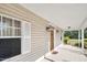 House exterior with covered porch and side entrance at 3782 Pine Cone Ln, Ormond Beach, FL 32174
