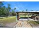Covered storage area with gravel flooring at 3782 Pine Cone Ln, Ormond Beach, FL 32174