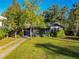 Charming bungalow with a spacious yard and a long driveway at 410 N Thorpe Ave, Orange City, FL 32763