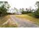 Exterior view of new metal building on a gravel driveway at 4101 Budd Rd, New Smyrna Beach, FL 32168