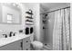 Clean bathroom with gray vanity, shower, and patterned shower curtain at 454 Ellsworth St, Altamonte Springs, FL 32701