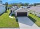 Aerial view of a single-story house, showcasing its driveway and surrounding neighborhood at 4619 Barnacle Dr, Port Orange, FL 32127