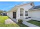 Front entrance of a house featuring a decorative door and a welcoming sign at 4619 Barnacle Dr, Port Orange, FL 32127