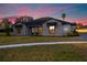 Brick house with gray roof, landscaping, and walkway at 500 Whitecap Cove Ct, Debary, FL 32713