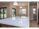 Kitchen island with quartz countertop and a gold faucet at 500 Whitecap Cove Ct, Debary, FL 32713