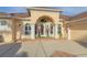 Elegant front entry with decorative columns and a welcoming porch at 614 Mura Ct, New Smyrna Beach, FL 32168