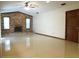 Spacious living room featuring a brick fireplace and tile floors at 641 Fairhaven St, Deltona, FL 32725