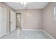 Simple bedroom with vinyl flooring and closet at 711 S Pearl St, Deland, FL 32720