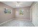 Light-filled bedroom with vinyl flooring and double closets at 711 S Pearl St, Deland, FL 32720