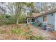 Backyard area with patio and storage amidst natural surroundings at 855 E Church St, Deland, FL 32724