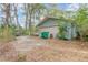 Detached garage with a large door and driveway access at 855 E Church St, Deland, FL 32724