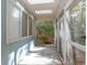 Spacious screened-in sunroom with skylights and views of nature at 855 E Church St, Deland, FL 32724