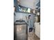 Laundry room with washer, dryer, and storage shelves at 893 W Village Dr, Deltona, FL 32725