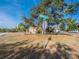 Residential street view showing home exterior and landscaping at 902 Millenbeck Ave, Deltona, FL 32725