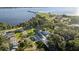 Aerial view of a teal house near the water and park at 1146 Riverside Dr, Daytona Beach, FL 32117