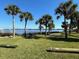 Spacious backyard with picnic table and chairs overlooking the water at 1146 Riverside Dr, Daytona Beach, FL 32117