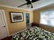 Bright bedroom with ensuite bathroom access, featuring a ceiling fan and large window at 1146 Riverside Dr, Daytona Beach, FL 32117