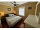 Main bedroom with hardwood floors and large window at 1146 Riverside Dr, Daytona Beach, FL 32117
