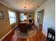 Bright dining room with hardwood floors and a round table at 1146 Riverside Dr, Daytona Beach, FL 32117