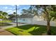 House exterior showcasing the driveway, landscaping, and garage at 1146 Riverside Dr, Daytona Beach, FL 32117