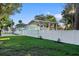 Side view of teal house with carport and white fence at 1146 Riverside Dr, Daytona Beach, FL 32117