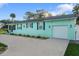 House exterior with driveway and landscaping at 1146 Riverside Dr, Daytona Beach, FL 32117