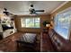 Bright living room with a view, leather seating, and a large TV at 1146 Riverside Dr, Daytona Beach, FL 32117