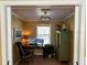 Home office with built-in shelving and hardwood floors at 1146 Riverside Dr, Daytona Beach, FL 32117