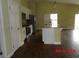 Kitchen with stainless steel appliances and granite countertops alongside wood-look tile flooring at 2301 9Th Ave, Deland, FL 32724