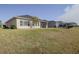 Property featuring a large backyard and screened patio at 277 Cyan Ave, Daytona Beach, FL 32124