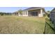 Home with spacious backyard, screened patio, and grassy area at 277 Cyan Ave, Daytona Beach, FL 32124