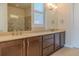 Double vanity bathroom with a shower and window at 277 Cyan Ave, Daytona Beach, FL 32124