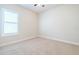 Simple bedroom with carpeted floor and window at 277 Cyan Ave, Daytona Beach, FL 32124