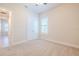 Bright bedroom with carpeted floor, double doors, and plantation shutters at 277 Cyan Ave, Daytona Beach, FL 32124