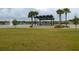 Relaxing gazebo by the lake with a fountain and manicured lawn at 277 Cyan Ave, Daytona Beach, FL 32124