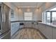 Modern community kitchen with stainless steel appliances and light gray cabinets at 277 Cyan Ave, Daytona Beach, FL 32124