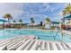 Resort-style pool with palm trees and lounge areas at 277 Cyan Ave, Daytona Beach, FL 32124