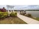 Fishing dock with a pergola and seating near a lake at 277 Cyan Ave, Daytona Beach, FL 32124