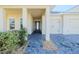 Covered front porch with paver stone flooring and seating area at 277 Cyan Ave, Daytona Beach, FL 32124