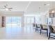 Open floor plan Gathering room with view to kitchen and access to backyard patio at 277 Cyan Ave, Daytona Beach, FL 32124
