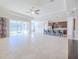 Open floor plan Gathering room with view to kitchen and access to backyard patio at 277 Cyan Ave, Daytona Beach, FL 32124