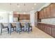 Modern kitchen with dark wood cabinets, quartz countertops, and stainless steel appliances at 277 Cyan Ave, Daytona Beach, FL 32124