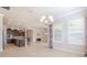 Open kitchen with island, dark cabinets, and tile flooring at 277 Cyan Ave, Daytona Beach, FL 32124