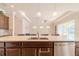 Kitchen island with sink, stainless steel dishwasher, and view to Gathering room at 277 Cyan Ave, Daytona Beach, FL 32124